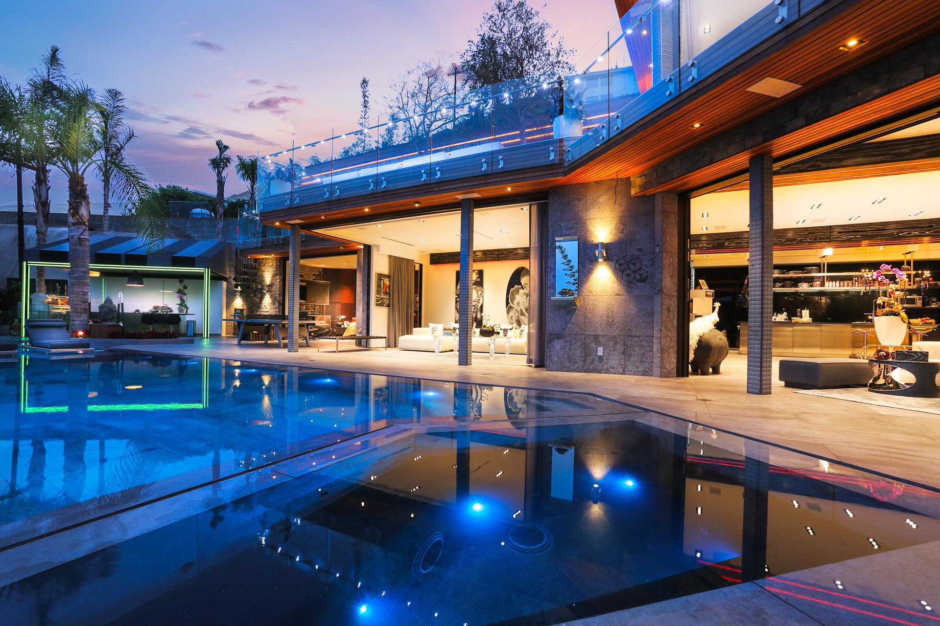 Glass residence lit at night